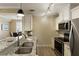 Well-equipped kitchen with stainless steel appliances, granite counters, and white cabinets open to the living space at 1101 Juniper Ne St # 632, Atlanta, GA 30309