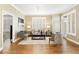 Sophisticated living room featuring hardwood floors, neutral colors, plantation shutters, and a cozy seating arrangement at 1101 Juniper Ne St # 632, Atlanta, GA 30309