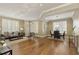 Inviting living room with hardwood floors, neutral décor, plantation shutters, and an elegant dining area at 1101 Juniper Ne St # 632, Atlanta, GA 30309