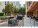 Beautiful outdoor patio space with lounge seating, dining and grilling area for entertaining guests at 1101 Juniper Ne St # 632, Atlanta, GA 30309