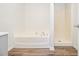 Bathroom featuring a soaking tub and shower at 1104 Driftwood Ct, Mcdonough, GA 30252