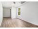 A vacant bedroom featuring wood-look flooring and a window at 1104 Driftwood Ct, Mcdonough, GA 30252