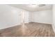 A vacant bedroom with wood-look flooring and plenty of natural light at 1104 Driftwood Ct, Mcdonough, GA 30252