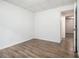 A vacant bedroom with wood-look flooring and neutral walls, ready for personalization at 1104 Driftwood Ct, Mcdonough, GA 30252