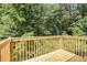 The wooden deck overlooks a lush, green landscape at 1104 Driftwood Ct, Mcdonough, GA 30252