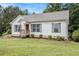 Inviting single-story home showcases a well-kept lawn, neutral siding, and a welcoming front porch at 1104 Driftwood Ct, Mcdonough, GA 30252
