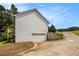A home's exterior view shows the home's garage at 1104 Driftwood Ct, Mcdonough, GA 30252
