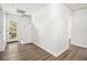 The hallway has wood-look flooring, a staircase, and access to an outdoor door at 1104 Driftwood Ct, Mcdonough, GA 30252