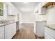 Bright kitchen with granite countertops flowing into adjacent dining room at 1104 Driftwood Ct, Mcdonough, GA 30252