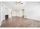 Bright living room boasts a fireplace, high ceilings, and modern flooring with ample natural light at 1104 Driftwood Ct, Mcdonough, GA 30252