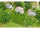 Overhead perspective of a home with a spacious, fenced-in backyard and mature trees at 2055 Cactus Ln, Cumming, GA 30040