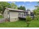 A wooden back deck with a black metal railing and pergola at 2055 Cactus Ln, Cumming, GA 30040