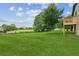 Spacious and well-maintained backyard with mature trees and lush green lawn at 2055 Cactus Ln, Cumming, GA 30040