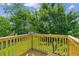 This deck features wood railings and green views at 2055 Cactus Ln, Cumming, GA 30040