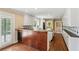 Modern kitchen with white cabinets, hardwood floors, and access to the outdoor patio at 2055 Cactus Ln, Cumming, GA 30040