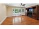Cozy living room featuring hardwood floors, built-in entertainment center and window seat at 2055 Cactus Ln, Cumming, GA 30040