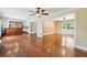 Open-concept living and kitchen area with hardwood floors and breakfast bar at 2055 Cactus Ln, Cumming, GA 30040