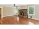 Living room with hardwood floors and stone fireplace at 2055 Cactus Ln, Cumming, GA 30040