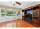Living room with hardwood floors, bay window, and a custom entertainment center at 2055 Cactus Ln, Cumming, GA 30040