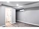 Finished basement area with modern color palette and access to bathroom at 2745 Saxon Drive, Duluth, GA 30096