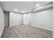 Finished basement with light gray walls, laminate flooring and recessed lighting at 2745 Saxon Drive, Duluth, GA 30096