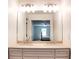 Bathroom featuring a double sink vanity, large mirror, and view of an adjoining bedroom at 2745 Saxon Drive, Duluth, GA 30096