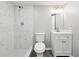 The bathroom features a shower with marble-look tiled walls at 2745 Saxon Drive, Duluth, GA 30096