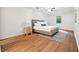 Serene bedroom features neutral tones, a comfortable bed, and a geometric rug at 2745 Saxon Drive, Duluth, GA 30096