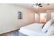 Bedroom featuring neutral walls, ceiling fan, and view of the adjoining bathroom at 2745 Saxon Drive, Duluth, GA 30096