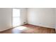 Bright bedroom with hardwood floors and a large window providing natural light at 2745 Saxon Drive, Duluth, GA 30096