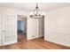 Dining room with wood floors and classic trim with doorway to hallway at 2745 Saxon Drive, Duluth, GA 30096