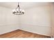 Open dining room with wood flooring and elegant crown molding at 2745 Saxon Drive, Duluth, GA 30096