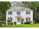 Charming white brick home with well-manicured lawn and mature trees offering great curb appeal at 2745 Saxon Drive, Duluth, GA 30096