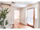Inviting foyer with staircase and view to a hallway and front door at 2745 Saxon Drive, Duluth, GA 30096