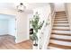 Bright foyer with hardwood floors, open staircase and view to living area at 2745 Saxon Drive, Duluth, GA 30096