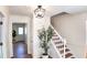 Inviting foyer with staircase, decorative lighting, and view to a hallway at 2745 Saxon Drive, Duluth, GA 30096