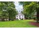 Well-maintained front yard featuring a lush green lawn and beautiful shade trees surrounding the home at 2745 Saxon Drive, Duluth, GA 30096
