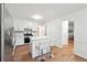 Bright kitchen featuring stainless appliances, white cabinets, and breakfast bar at 2745 Saxon Drive, Duluth, GA 30096