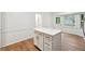 Spacious kitchen with an island, white cabinets, and modern hardware at 2745 Saxon Drive, Duluth, GA 30096