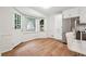 Eat-in kitchen area features new flooring, stainless steel appliances, and lots of natural light at 2745 Saxon Drive, Duluth, GA 30096