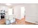Modern kitchen featuring stainless steel appliances, white cabinets and a kitchen island with seating at 2745 Saxon Drive, Duluth, GA 30096