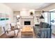 Living room with fireplace and modern furnishings, complemented by light wood floors and serene artwork at 2745 Saxon Drive, Duluth, GA 30096
