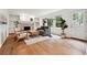 Stylish living room with hardwood floors, fireplace, built-in shelving and abundant natural light at 2745 Saxon Drive, Duluth, GA 30096