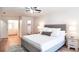 Spacious main bedroom boasts a ceiling fan and connecting bathroom and closet at 2745 Saxon Drive, Duluth, GA 30096