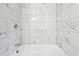 Close up of the shower with marble-look tile surround at 2745 Saxon Drive, Duluth, GA 30096