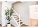 Bright foyer featuring a staircase and a decorative potted plant at 2745 Saxon Drive, Duluth, GA 30096