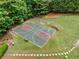 Aerial view of the community basketball court, a recreational area nestled amongst mature trees at 4715 Northridge Dr, Cumming, GA 30040