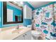Brightly painted bathroom includes a modern sink and patterned shower curtain at 4715 Northridge Dr, Cumming, GA 30040