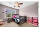 Bedroom with a ceiling fan, window and furniture at 4715 Northridge Dr, Cumming, GA 30040