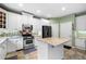 Modern kitchen with granite counters, island and stainless appliances at 4715 Northridge Dr, Cumming, GA 30040